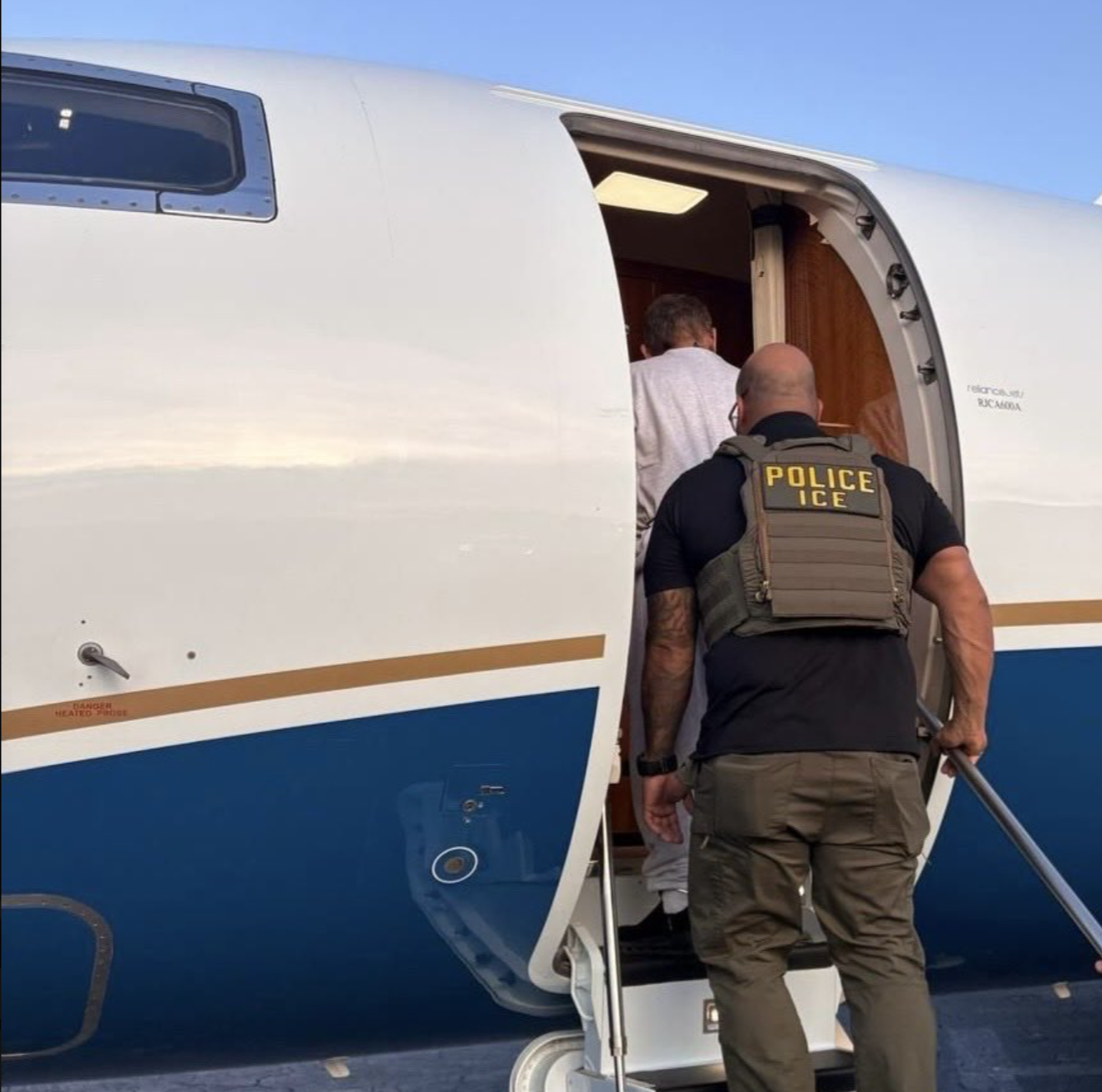 José Serrano, Ecuador's former interior minister, is escorted onto a private deportation flight from the U.S by ICE, August 2026 (source: https://x.com/DanielNoboaOk/status/2093489752464859513/photo/2)